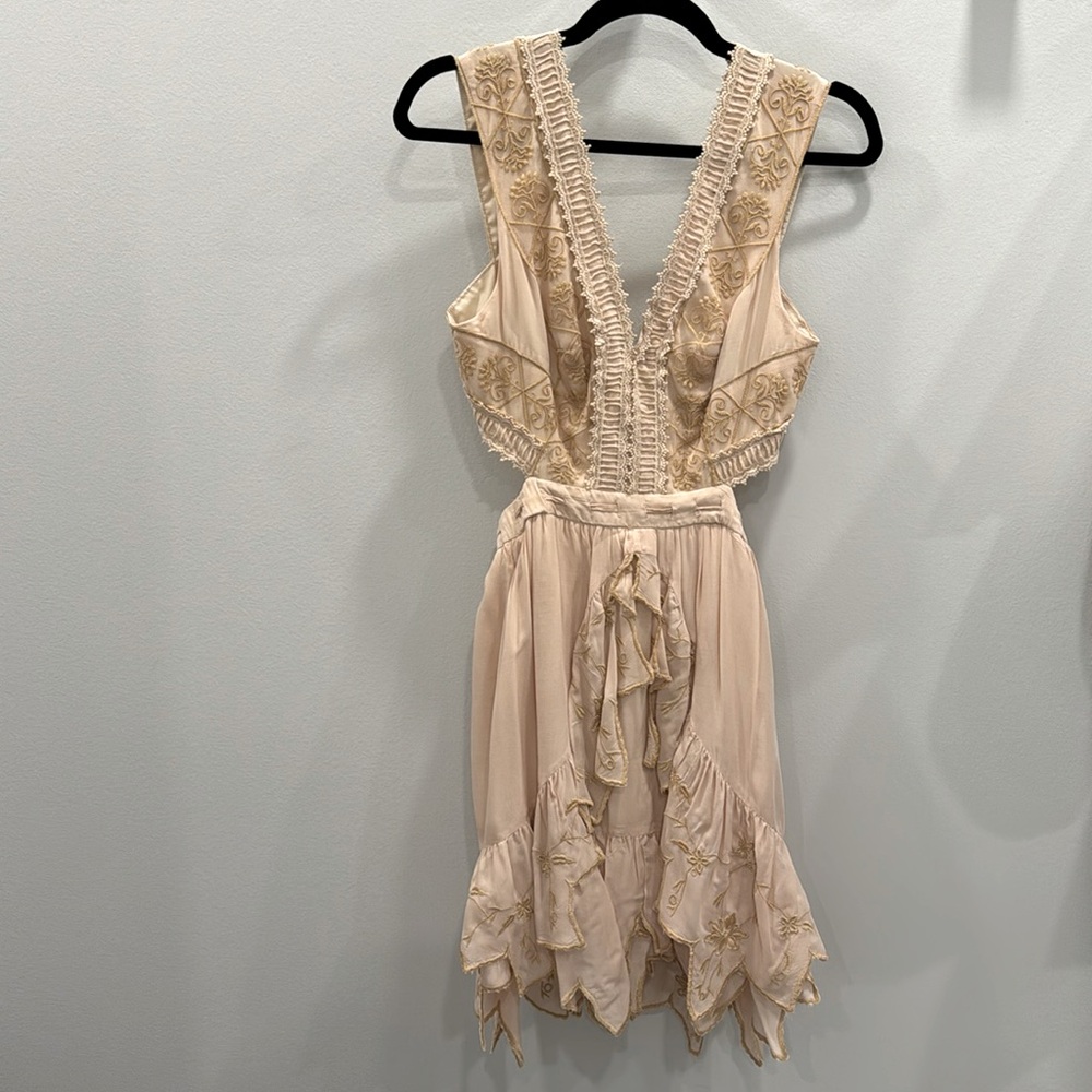 Light pink cream cut out dress lightly worn. Size 2 US